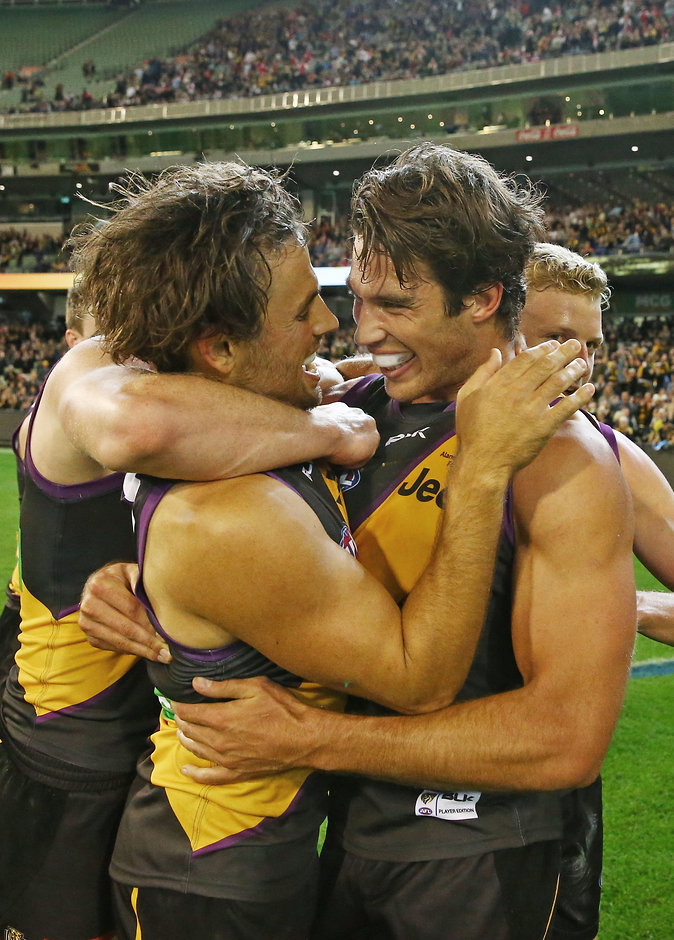 AFL 2016 Rd 08 - Richmond v Sydney MELBOURNE, AUSTRALIA - MAY 14: Sam Lloyd of the Tigers is congratulated by Alex Rance of the Tigers after kicking the match-winning goal after the final siren during the 2016 AFL Round 08 match between the Richmond Tigers and the Sydney Swans at the Melbourne Cricket Ground, Melbourne on May 14, 2016. (Photo by Scott Barbour/AFL Media)